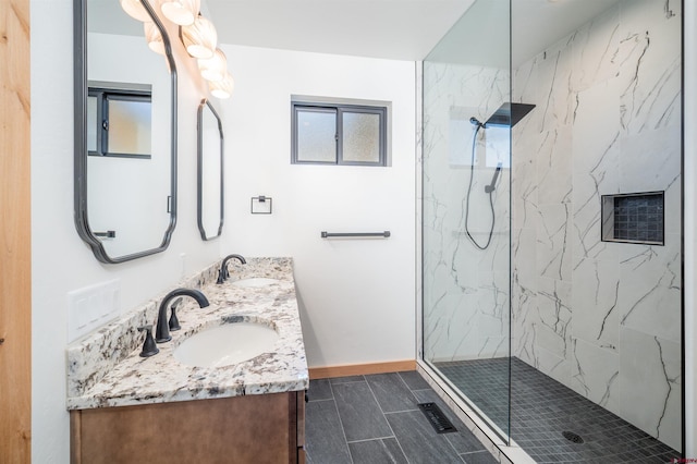 26217 Rd 38.5, Dolores, CO 81323 - full bathroom featuring a marble finish shower, baseboards, double vanity, and tile patterned floors