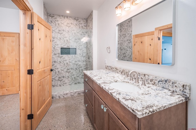 26217 Rd 38.5, Dolores, CO 81323 - bathroom featuring a tile shower, vanity, and recessed lighting
