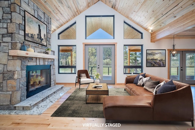 26217 Rd 38.5, Dolores, CO 81323 - living room featuring french doors, a fireplace, wood finished floors, wooden ceiling, and high vaulted ceiling