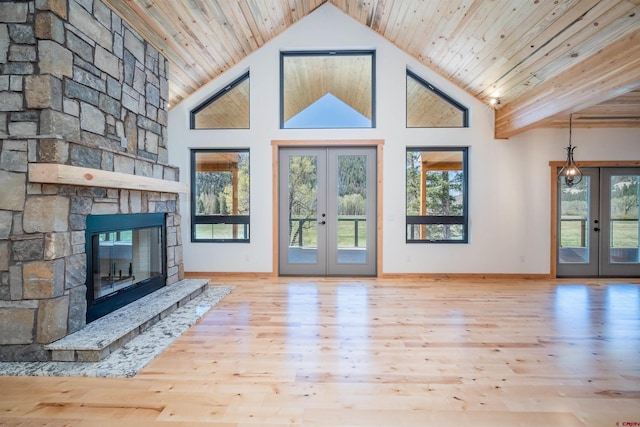 26217 Rd 38.5, Dolores, CO 81323 - unfurnished living room with french doors, healthy amount of natural light, baseboards, wood ceiling, and high vaulted ceiling