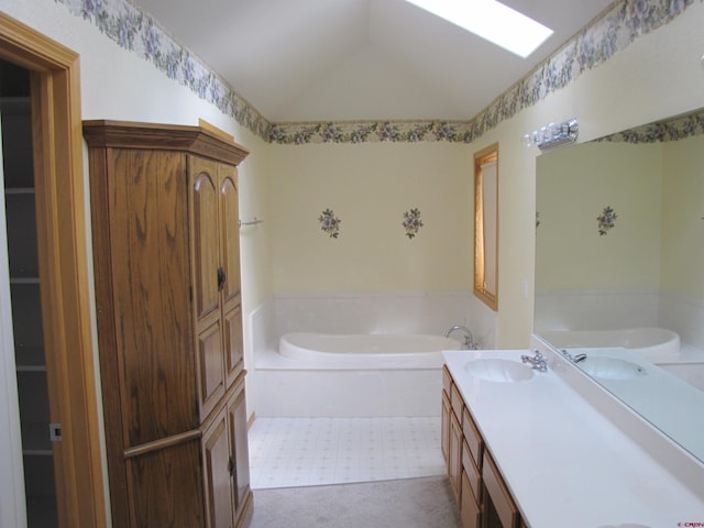 1770 Stellar Pl, Montrose, CO 81401 - full bathroom with a garden tub, double vanity, vaulted ceiling, and tile patterned floors