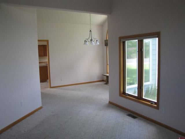 1770 Stellar Pl, Montrose, CO 81401 - empty room featuring carpet flooring, baseboards, and a chandelier