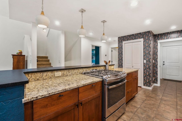 36 Tenderfoot Ct Unit J, Durango, CO 81301 - kitchen with gas range, wallpapered walls, pendant lighting, baseboards, and recessed lighting