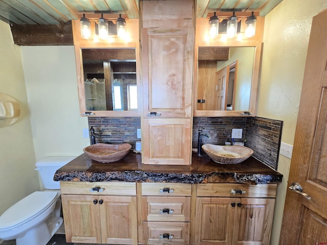 4189 Crowther Ln, Alamosa, CO 81101 - full bath featuring decorative backsplash, toilet, double vanity, and wood ceiling