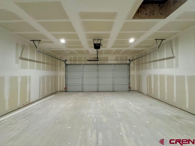 1911 Edison Ave, Alamosa, CO 81101 - garage featuring a garage door opener