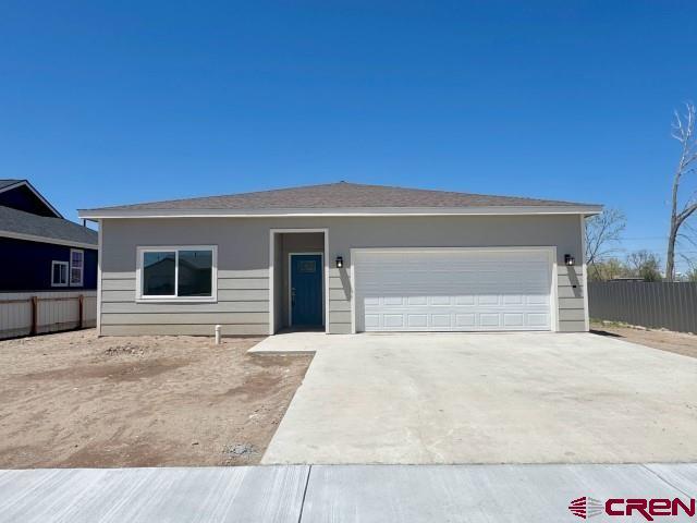 1911 Edison Ave, Alamosa, CO 81101 - ranch-style home featuring concrete driveway