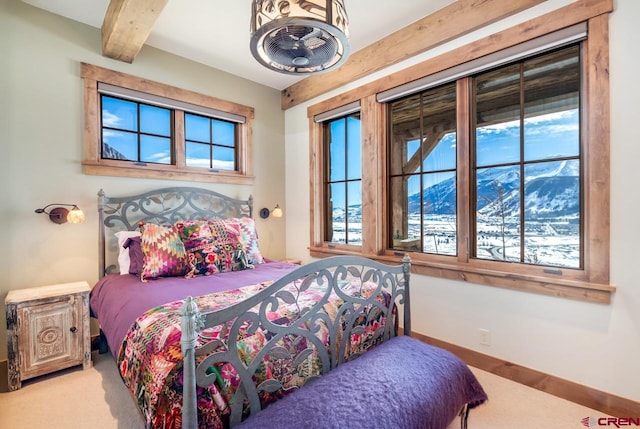 426 Saddle Ridge Ranch Rd, Crested Butte, CO 81224 - bedroom with beamed ceiling, carpet flooring, and baseboards