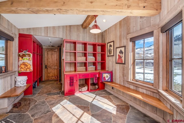 426 Saddle Ridge Ranch Rd, Crested Butte, CO 81224 - dining room with stone floors, plenty of natural light, and wooden walls