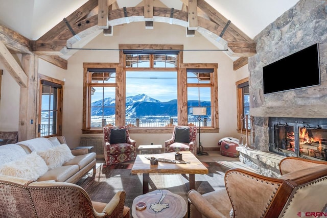 426 Saddle Ridge Ranch Rd, Crested Butte, CO 81224 - living room with a fireplace, high vaulted ceiling, and beam ceiling