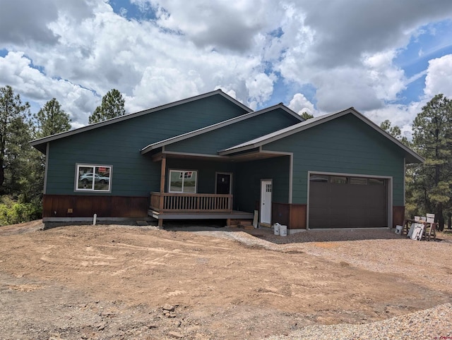 54 Lakewood St, Pagosa Springs, CO 81147 - view of front of home featuring an attached garage, driveway, and covered porch