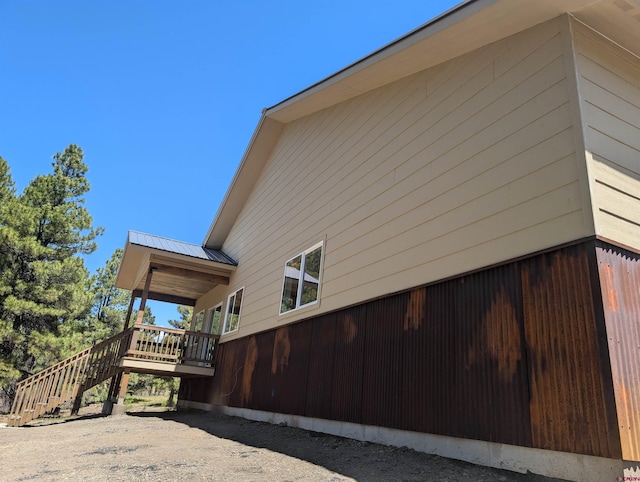 54 Lakewood St, Pagosa Springs, CO 81147 - view of side of home with stairway and a deck