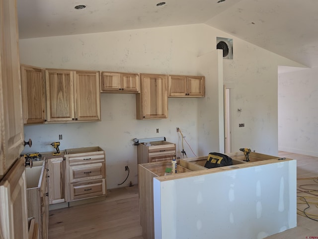 54 Lakewood St, Pagosa Springs, CO 81147 - kitchen featuring lofted ceiling, light wood-style flooring, light brown cabinets, and a kitchen island