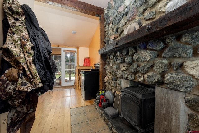 3515 Bennett St, Durango, CO 81301 - living area with a wood stove, vaulted ceiling, and light wood finished floors