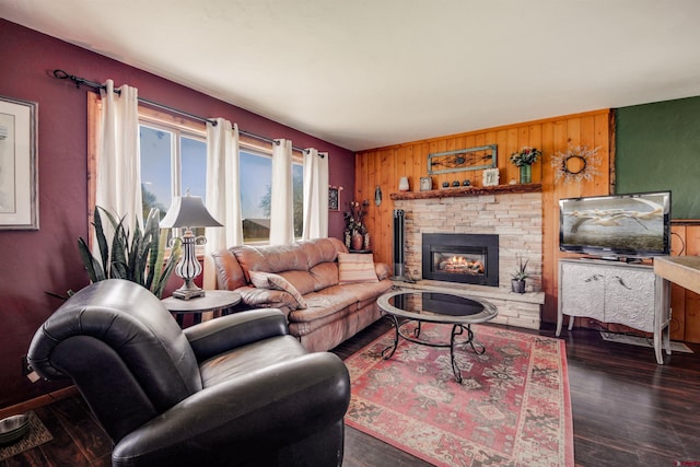 399 E Schroder Dr, Bayfield, CO 81122 - living area featuring wood walls, wood finished floors, a fireplace, and an accent wall