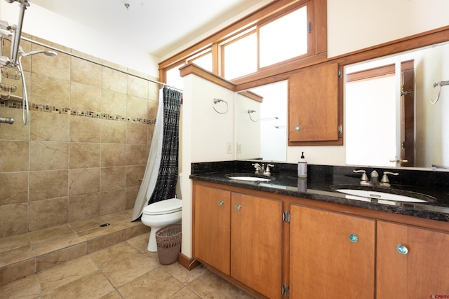 323 3rd Ave, Ouray, CO 81427 - bathroom with double vanity, toilet, and tiled shower