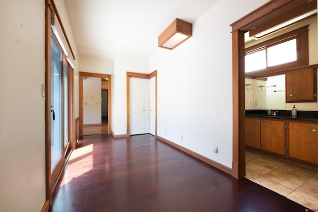 323 3rd Ave, Ouray, CO 81427 - corridor featuring dark wood finished floors, baseboards, and a sink