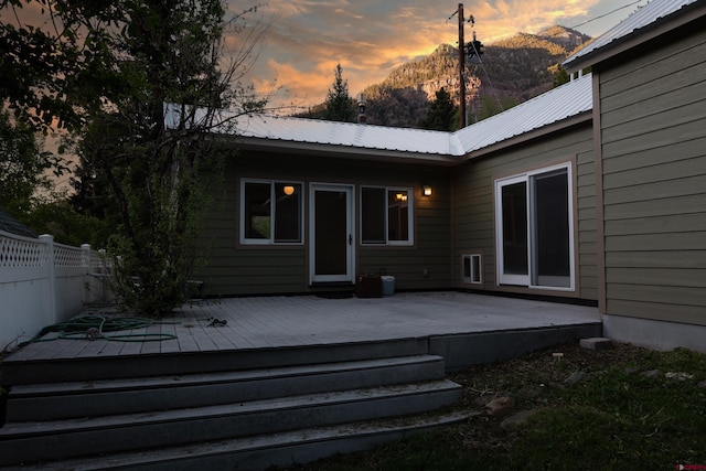 323 3rd Ave, Ouray, CO 81427 - back of property at dusk featuring metal roof and a deck with mountain view