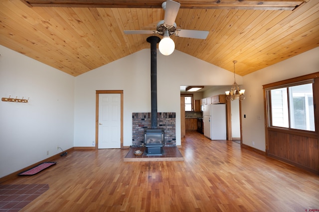 323 3rd Ave, Ouray, CO 81427 - unfurnished living room featuring a wood stove, ceiling fan, baseboards, light wood-style floors, and wood ceiling