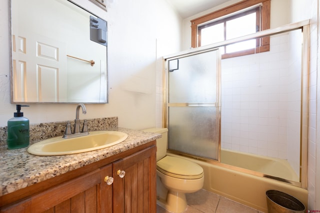 323 3rd Ave, Ouray, CO 81427 - full bath featuring vanity, toilet, enclosed tub / shower combo, and tile patterned floors