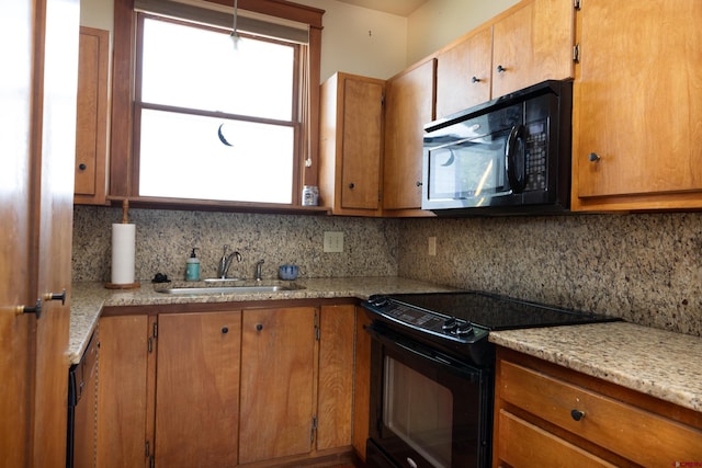 323 3rd Ave, Ouray, CO 81427 - kitchen with black appliances, a sink, tasteful backsplash, and brown cabinets
