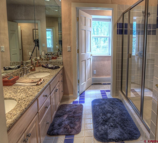 575 County Rd 253, Durango, CO 81301 - bathroom featuring double vanity, a shower stall, and tile patterned floors