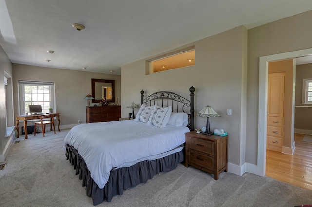 575 County Rd 253, Durango, CO 81301 - bedroom featuring light carpet, multiple windows, baseboards, and an office area
