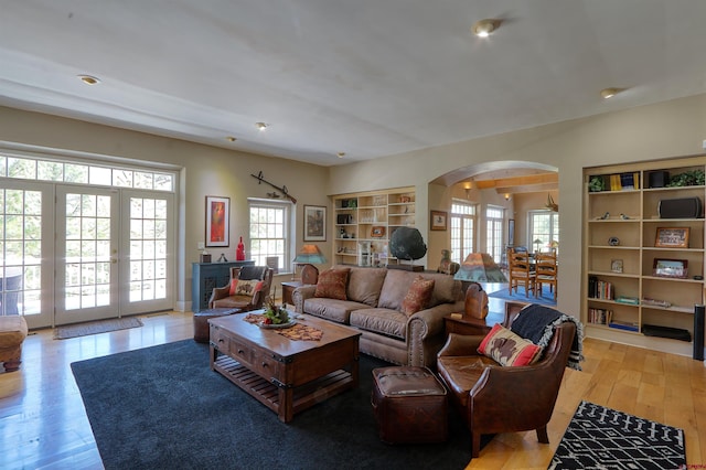 575 County Rd 253, Durango, CO 81301 - living room featuring arched walkways, light wood finished floors, recessed lighting, and built in shelves