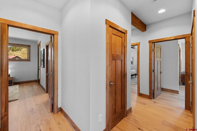 64 Buckhorn Way, Crested Butte, CO 81224 - hall featuring light wood-type flooring, baseboards, beam ceiling, and recessed lighting