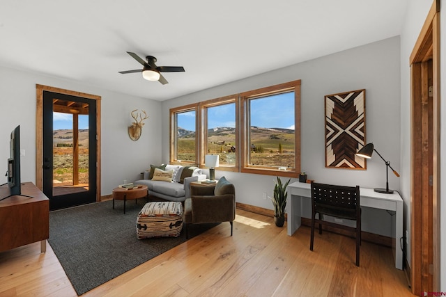 64 Buckhorn Way, Crested Butte, CO 81224 - living area with a ceiling fan, light wood-style flooring, and baseboards