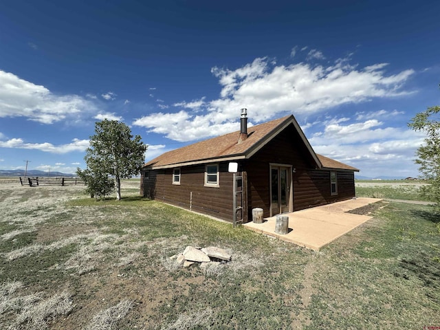 6477 W County Road 9n, Del Norte, CO 81132 - view of home's exterior with a patio area and roof with shingles