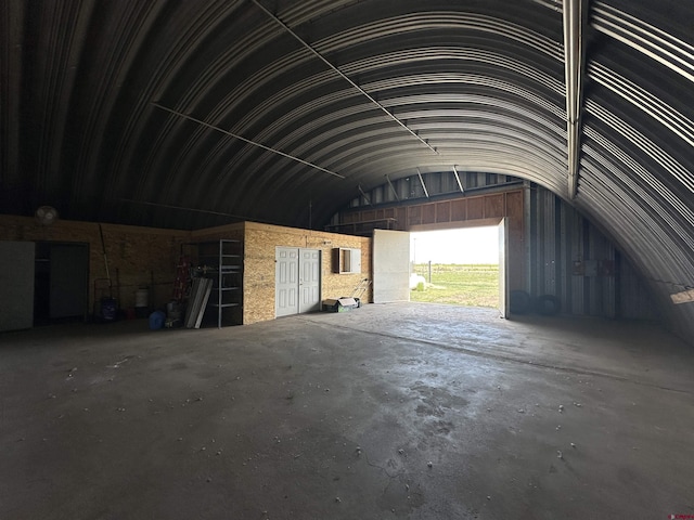 6477 W County Road 9n, Del Norte, CO 81132 - misc room featuring a garage, vaulted ceiling, and concrete flooring