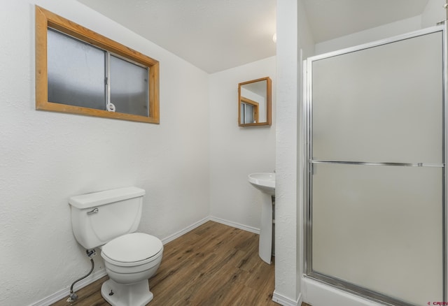 343 Deer Trail Ln, Bayfield, CO 81122 - bathroom with wood finished floors, a shower stall, toilet, and baseboards