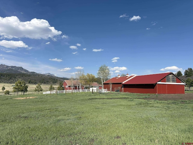 541 Perry Dr, Pagosa Springs, CO 81147 - view of yard with an outbuilding, a rural view, and a mountain view