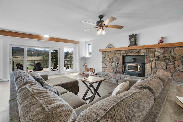 541 Perry Dr, Pagosa Springs, CO 81147 - living area with ceiling fan and a wood stove