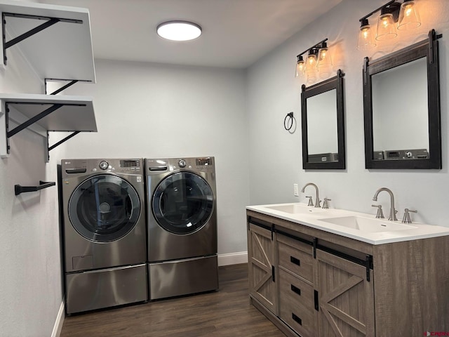 541 Perry Dr, Pagosa Springs, CO 81147 - washroom featuring independent washer and dryer, baseboards, dark wood-type flooring, and a barn door