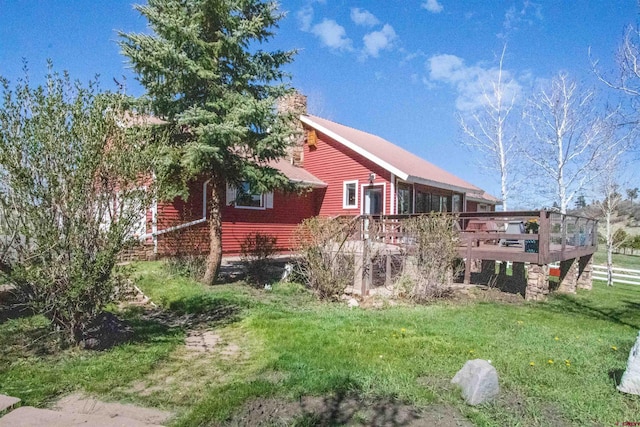 541 Perry Dr, Pagosa Springs, CO 81147 - back of house with a wooden deck and a lawn