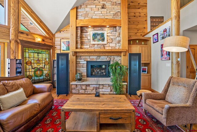 50 W Durango Ridge Rd, Durango, CO 81301 - living area with wood finished floors, a stone fireplace, and high vaulted ceiling