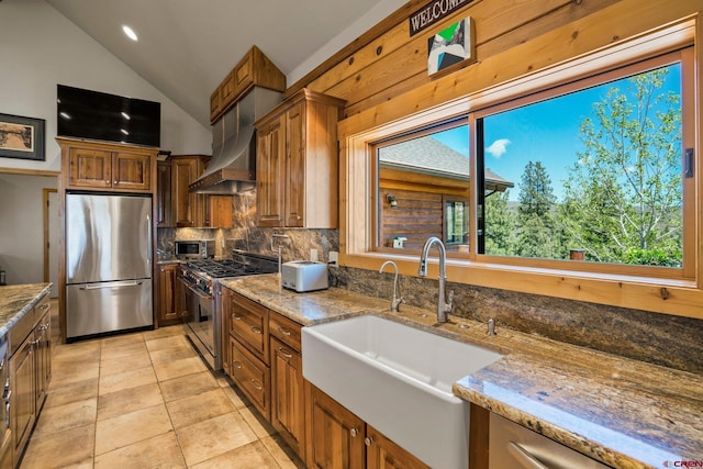 50 W Durango Ridge Rd, Durango, CO 81301 - kitchen with appliances with stainless steel finishes, a sink, backsplash, lofted ceiling, and light stone countertops