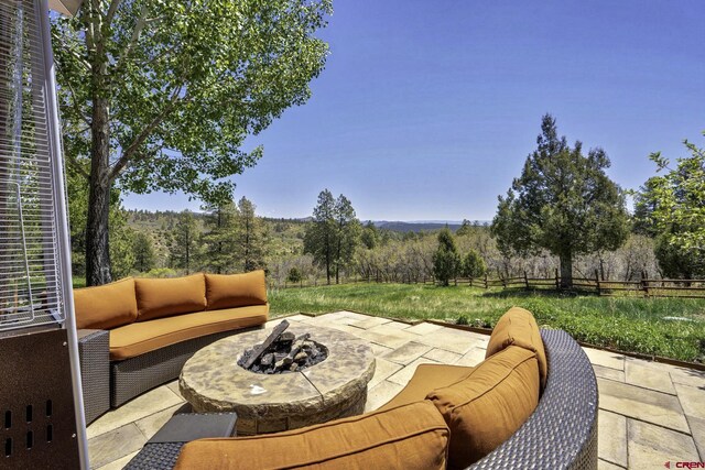 50 W Durango Ridge Rd, Durango, CO 81301 - view of patio / terrace with an outdoor living space with a fire pit