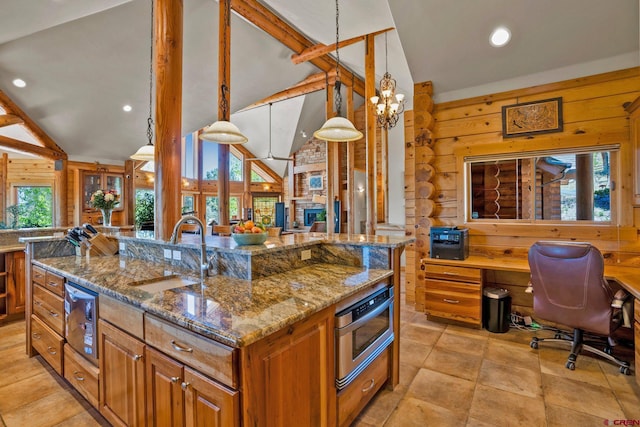 50 W Durango Ridge Rd, Durango, CO 81301 - kitchen featuring a sink, open floor plan, an office area, recessed lighting, and brown cabinetry