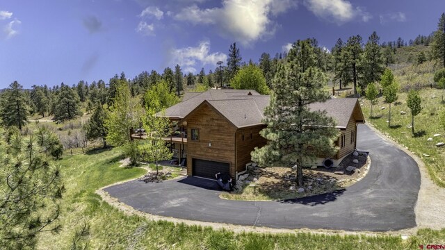 50 W Durango Ridge Rd, Durango, CO 81301 - view of property exterior with driveway, a garage, and a wooded view