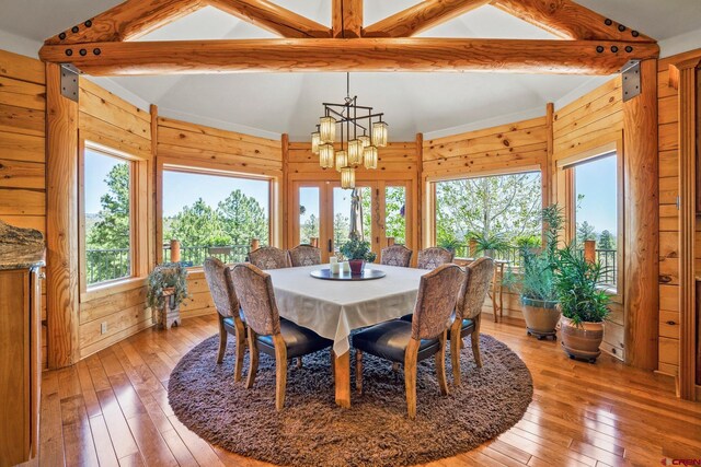 50 W Durango Ridge Rd, Durango, CO 81301 - dining space with light wood-style floors, wood walls, and a chandelier