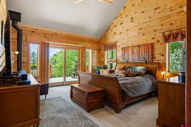 50 W Durango Ridge Rd, Durango, CO 81301 - bedroom with access to exterior, wood walls, lofted ceiling, and carpet floors