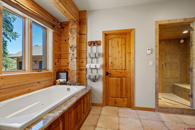 50 W Durango Ridge Rd, Durango, CO 81301 - full bath with a whirlpool tub, plenty of natural light, a stall shower, and baseboards