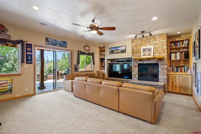50 W Durango Ridge Rd, Durango, CO 81301 - living area with light carpet, a ceiling fan, recessed lighting, a stone fireplace, and baseboards
