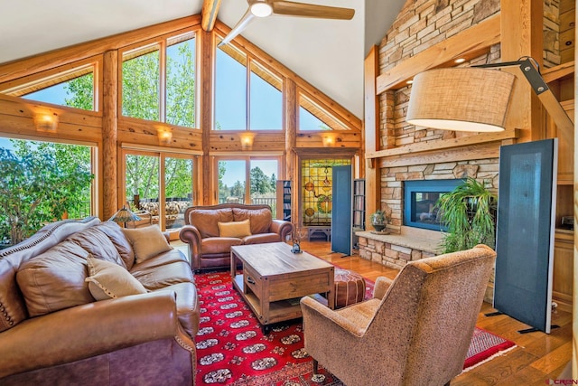 50 W Durango Ridge Rd, Durango, CO 81301 - living room featuring high vaulted ceiling, wood-type flooring, a ceiling fan, beamed ceiling, and a fireplace