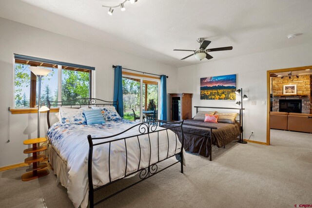 50 W Durango Ridge Rd, Durango, CO 81301 - bedroom with baseboards, carpet floors, a fireplace, and ceiling fan