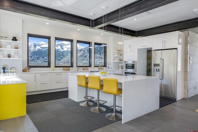 6 Moon Ridge Ln, Crested Butte, CO 81224 - kitchen with appliances with stainless steel finishes, open shelves, modern cabinets, white cabinetry, and recessed lighting