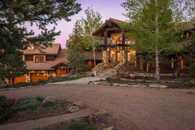 182 Juniper Rd S, Ridgway, CO 81432 - view of front of property featuring stone siding and dirt driveway