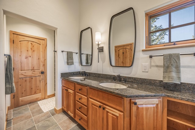182 Juniper Rd S, Ridgway, CO 81432 - bathroom featuring double vanity and baseboards